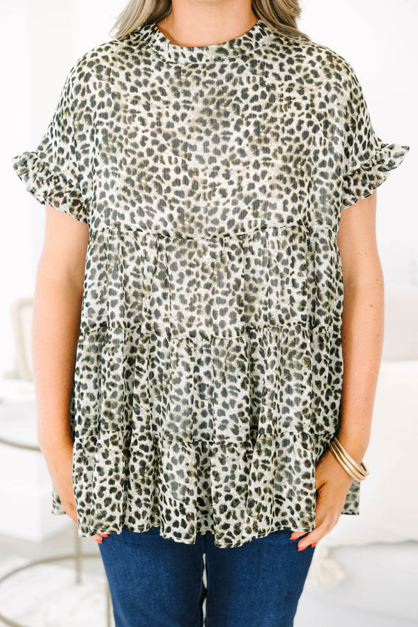 Plus size leopard print top with a flowy tiered silhouette and ruffle short sleeves.