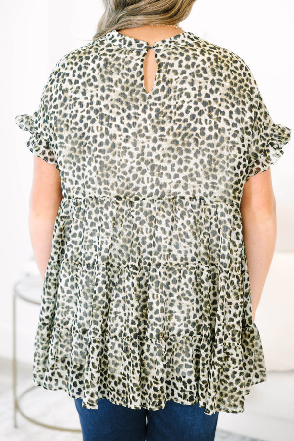 Plus size leopard print top with a flowy tiered silhouette and ruffle short sleeves.