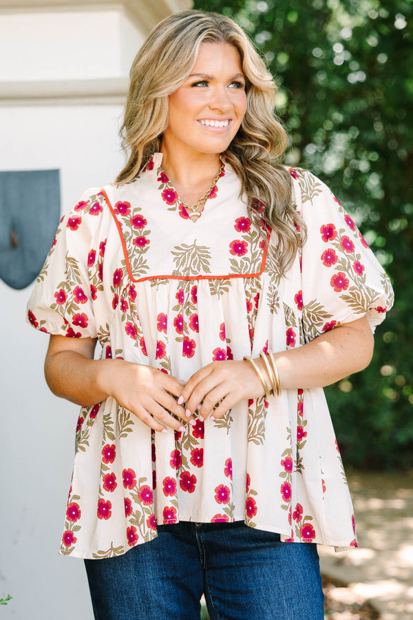 Plus Size cream babydoll top with red floral print, puff sleeves, and orange piping detail.