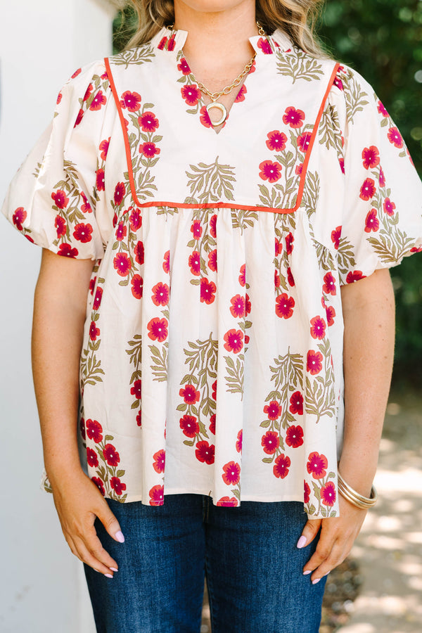 Plus Size cream babydoll top with red floral print, puff sleeves, and orange piping detail.