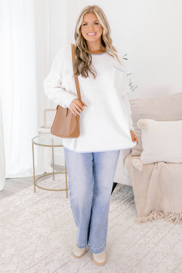 Chic Soul plus size clothing, ivory sweater with long sleeves and a front pocket of the left side of the chest as well as blue stitching details on the end of the sleeves around the neckline bottom of the sweater and outlining the top of the chest pocket 