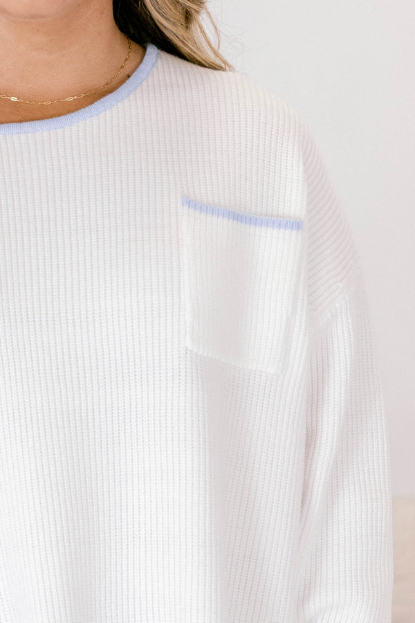 Chic Soul plus size clothing, ivory sweater with long sleeves and a front pocket of the left side of the chest as well as blue stitching details on the end of the sleeves around the neckline bottom of the sweater and outlining the top of the chest pocket 