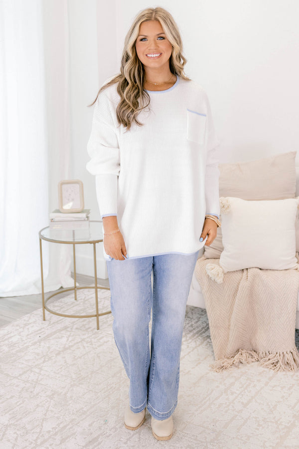 Chic Soul plus size clothing, ivory sweater with long sleeves and a front pocket of the left side of the chest as well as blue stitching details on the end of the sleeves around the neckline bottom of the sweater and outlining the top of the chest pocket 