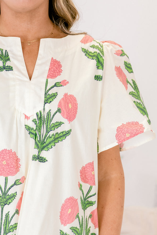 Chic Soul plus size clothing, cream knee length dress with short sleeves a slight v-neckline and a pink and green floral block pattern throughout 