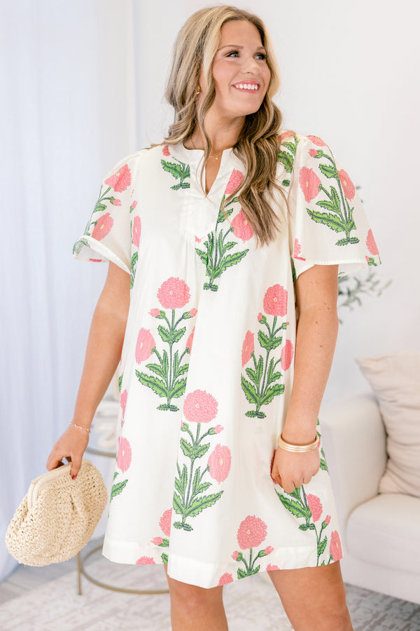 Chic Soul plus size clothing, cream knee length dress with short sleeves a slight v-neckline and a pink and green floral block pattern throughout 