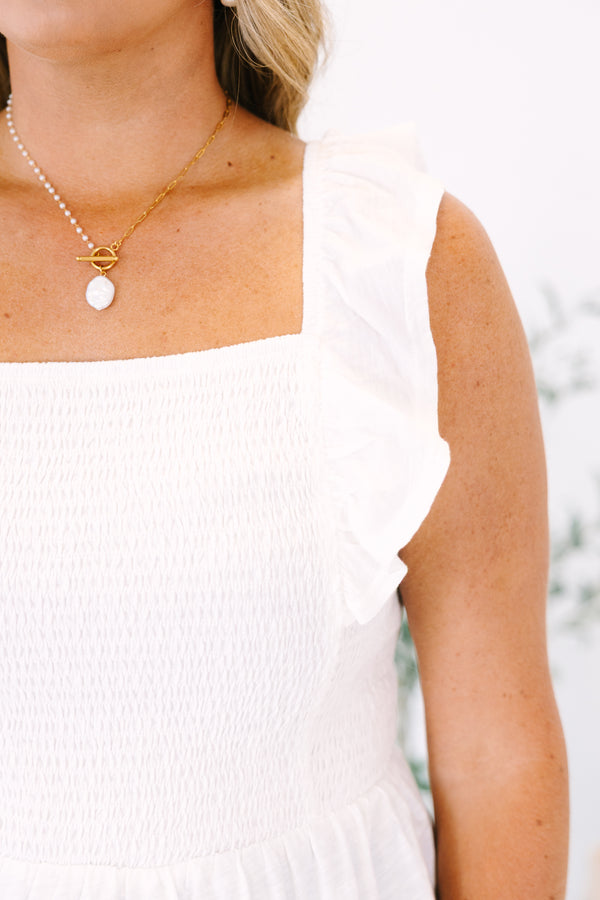 Plus Size white smocked babydoll top with ruffled straps and a peplum hem.
