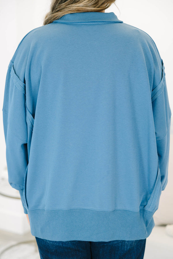 Plus Size blue long-sleeve pullover with a collared snap-button neckline and ribbed trim.
