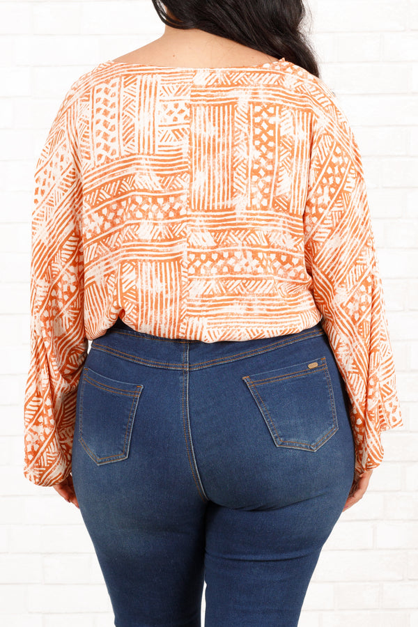 Chic Soul plus size clothing, rust and cream bohemian patterned bodysuit with crisscross neckline and bell sleeves