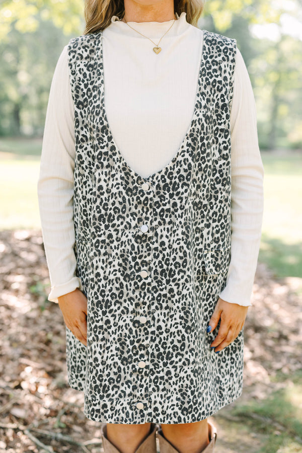Plus Size leopard print button-front jumper dress over a white long-sleeve turtleneck top.