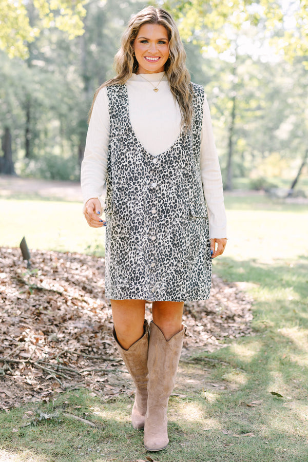 Plus Size leopard print button-front jumper dress over a white long-sleeve turtleneck top.