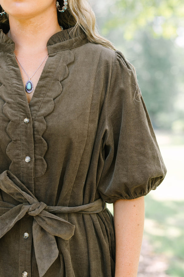 Plus Size brown corduroy mini dress with scalloped button front, puff sleeves, and a tie waist.