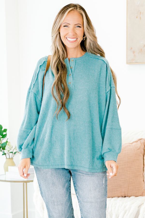 Chic Soul Plus size clothing, teal sweater with long bubble sleeves buttons going down the neckline and stitching details on the sleeves and bottom of the sweater 
