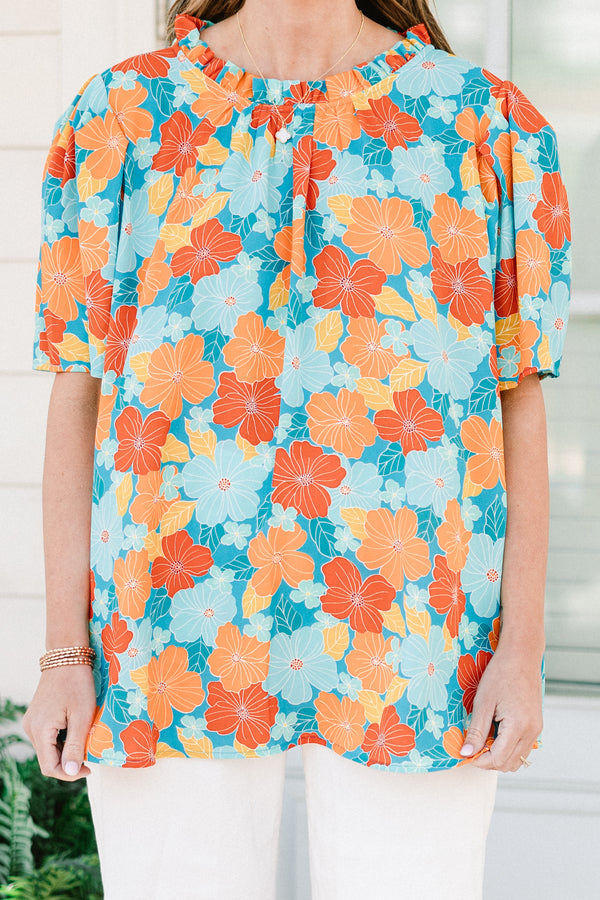 Chic Soul plus size clothing, blue short sleeve top with round neckline and puff sleeve detail with large orange/blue floral print