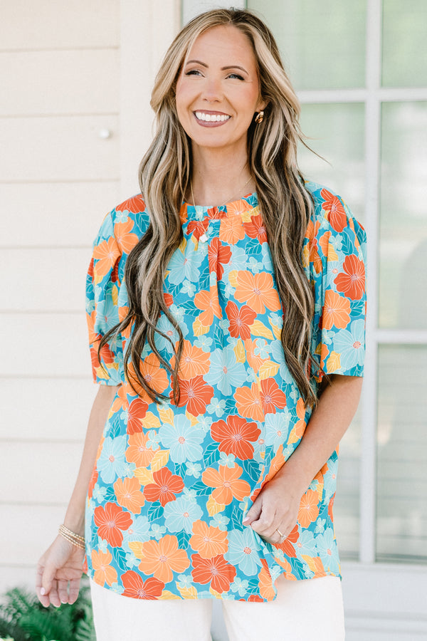 Chic Soul plus size clothing, blue short sleeve top with round neckline and puff sleeve detail with large orange/blue floral print