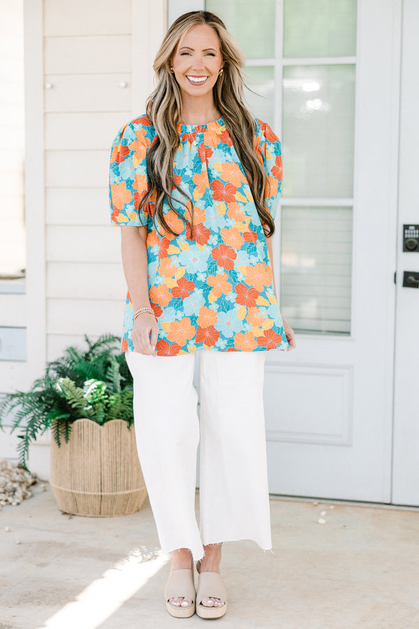Chic Soul plus size clothing, blue short sleeve top with round neckline and puff sleeve detail with large orange/blue floral print