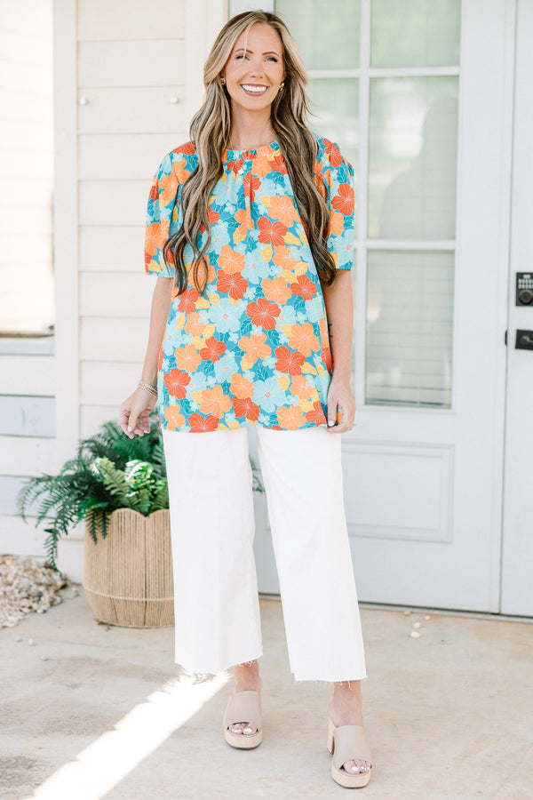 Chic Soul plus size clothing, blue short sleeve top with round neckline and puff sleeve detail with large orange/blue floral print