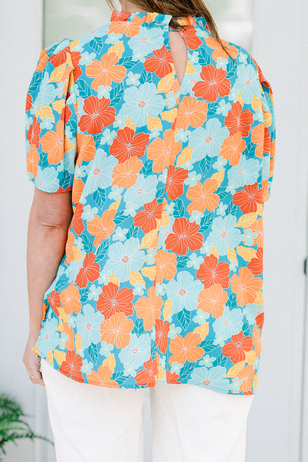 Chic Soul plus size clothing, blue short sleeve top with round neckline and puff sleeve detail with large orange/blue floral print