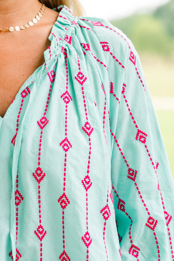 Chic Soul plus size clothing.  aqua half sleeve top with pink embroidery details throughout and a slight v-neck 