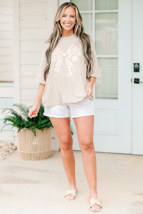 Chic Soul plus size clothing, short-sleeve stone tan drop-shoulder vintage wash tee with a high-scoop-neckline with a graphic of seashells in the shape of a bow