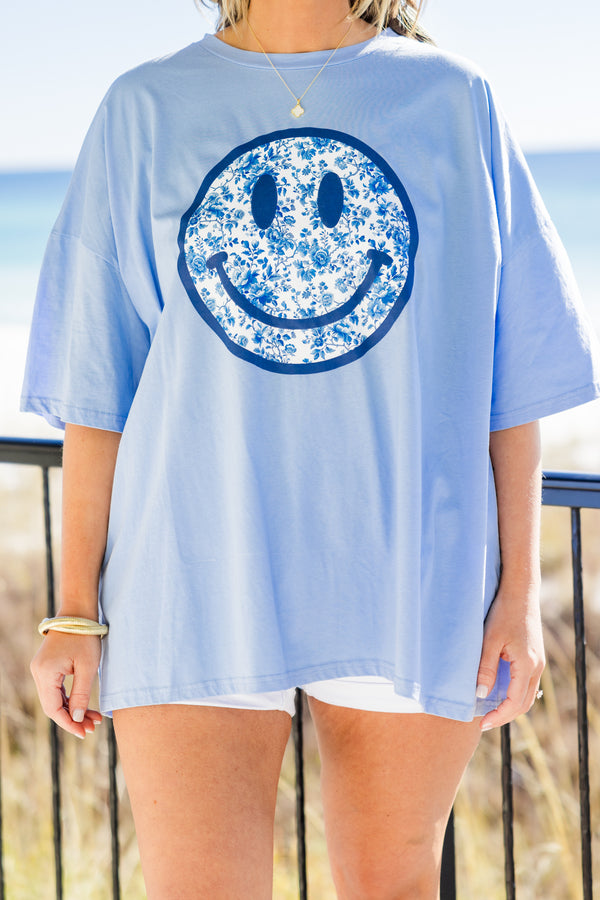 Chic Soul plus size clothing, spring blue short sleeve boyfriend tee with round neckline with dark blue smiley face graphic with blue and white floral print on the inside
