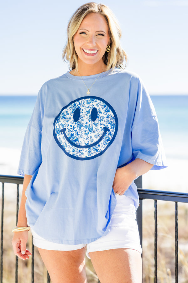 Chic Soul plus size clothing, spring blue short sleeve boyfriend tee with round neckline with dark blue smiley face graphic with blue and white floral print on the inside