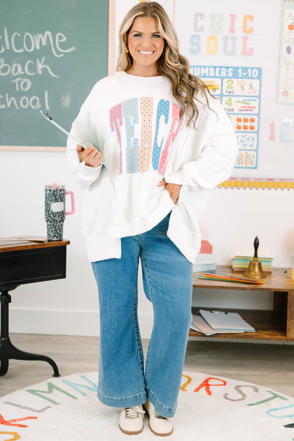 Plus Size ivory crew neck sweatshirt with a colorful polka dot 'TEACH' graphic on the front.