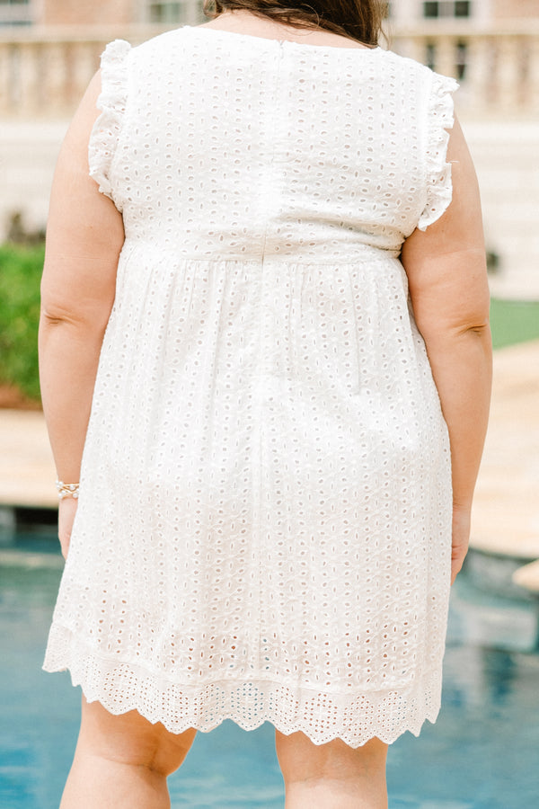 Plus Size white eyelet mini dress with flutter sleeves, a V-neckline, and a scalloped lace hem.