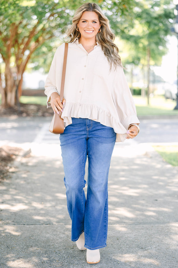 Plus Size medium wash flare jeans with a high-rise fit and classic five-pocket styling.