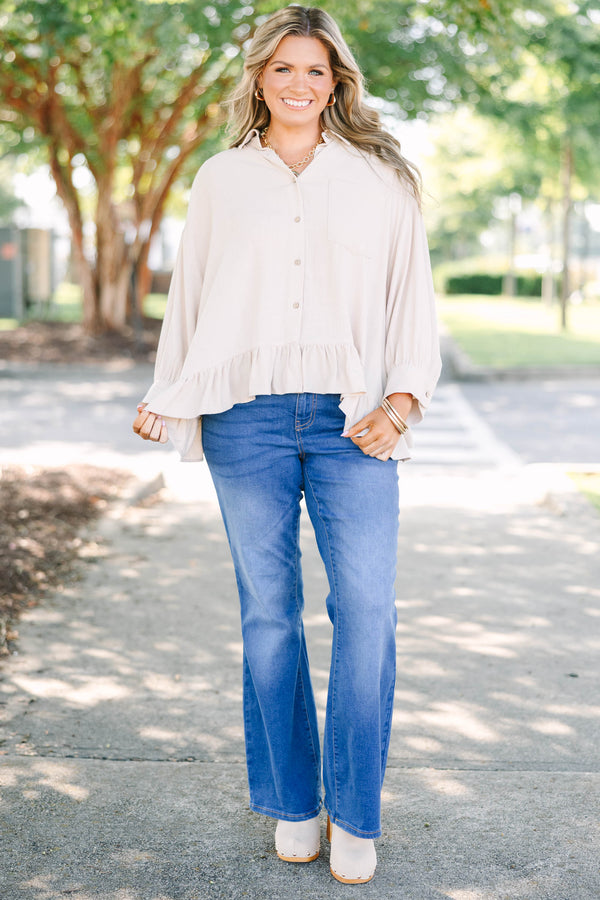Plus Size medium wash flare jeans with a high-rise fit and classic five-pocket styling.