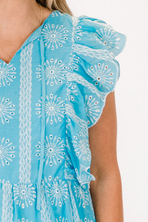 Chic Soul plus size clothing, blue sleeveless knee length babydoll dress with v neckline and ruffle along sleeves with white embroidered print