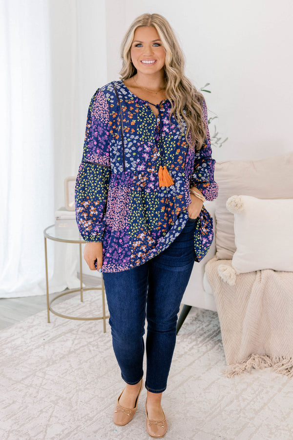 Chic Soul plus size clothing, navy floral long sleeve top with orange tassels hanging from the neckline 