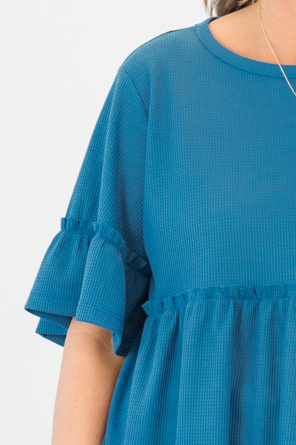 Chic Soul plus size clothing, blue short sleeve babydoll top with ruffle detail along sleeves and bottom with round neckline