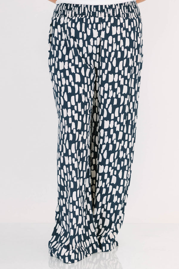Chic Soul plus size clothing, flowy pants with smocked waist and navy and white pattern