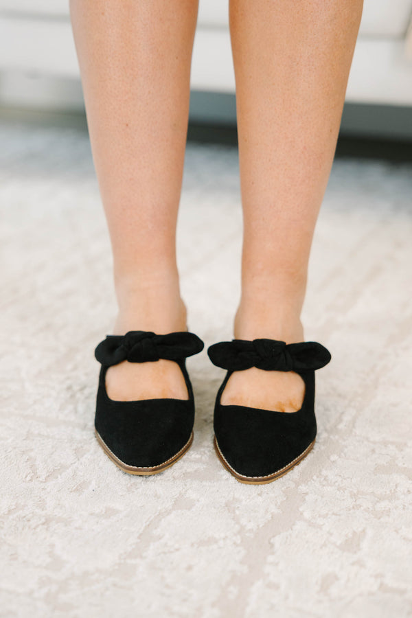 Plus Size black suede pointed-toe mule heels with a knotted bow strap and wooden block heel.