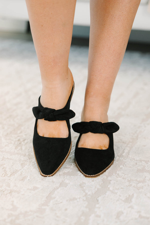 Plus Size black suede pointed-toe mule heels with a knotted bow strap and wooden block heel.