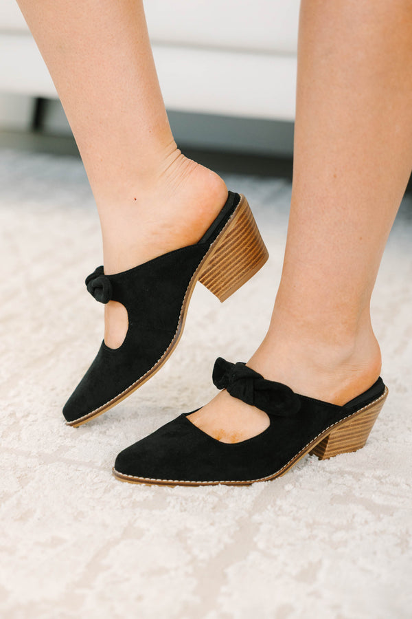 Plus Size black suede pointed-toe mule heels with a knotted bow strap and wooden block heel.