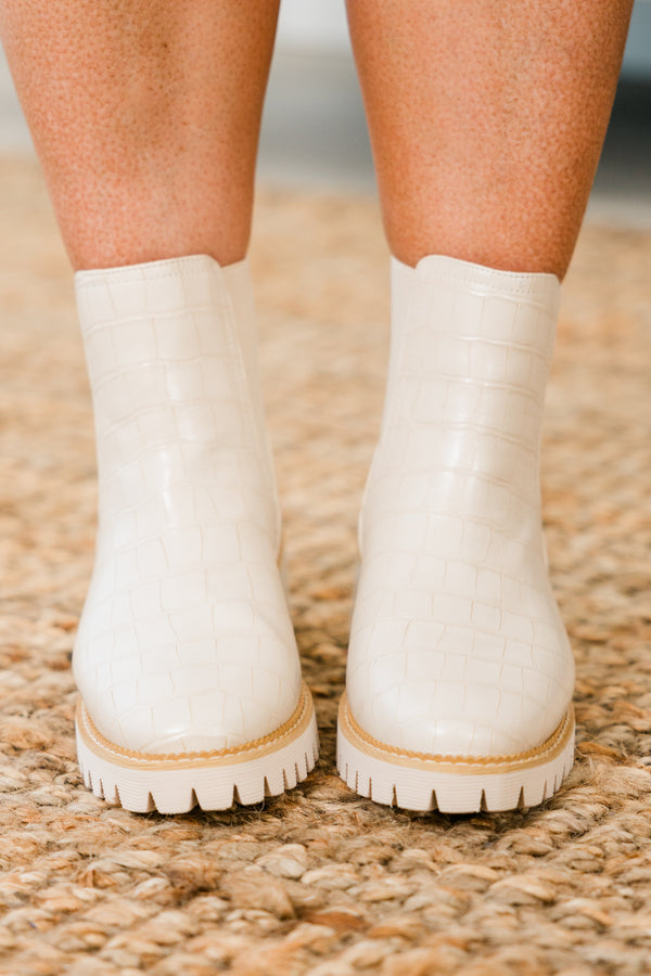 ivory chelsea booties with ivory heel and alligator print detailing with round-toe and light brown stitching along seams 