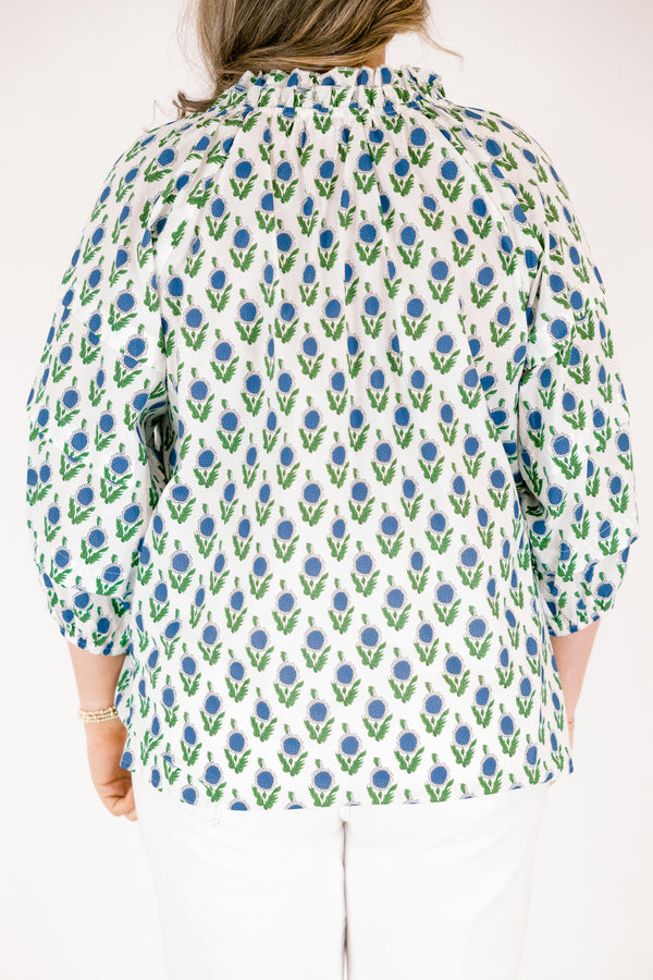 Chic Soul plus size clothing, white top with half bubble sleeves  slight v-neckline and a blue and green floral block pattern throughout