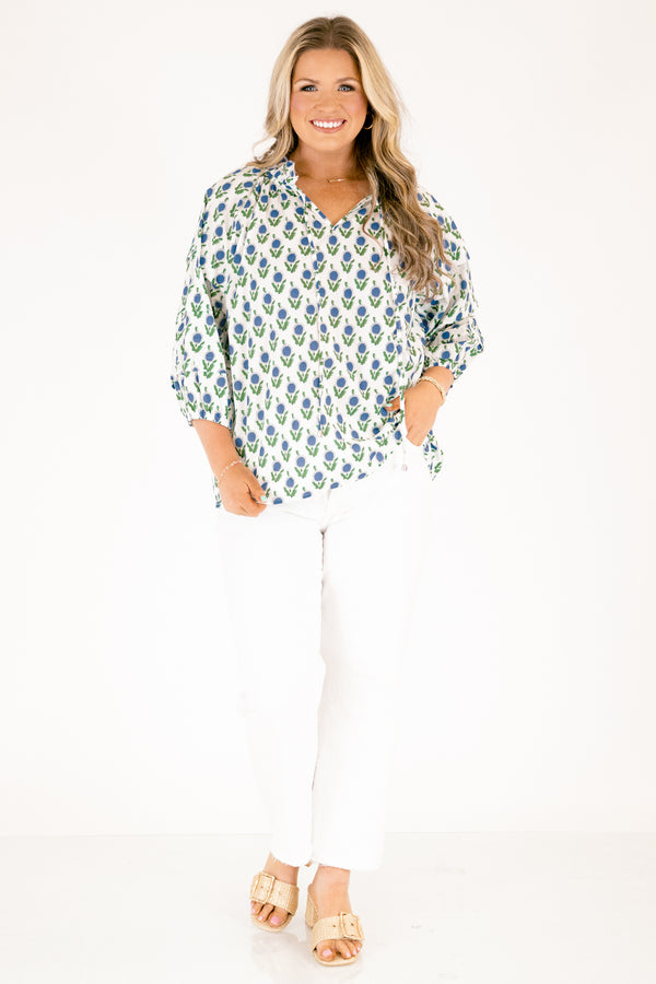 Chic Soul plus size clothing, white top with half bubble sleeves  slight v-neckline and a blue and green floral block pattern throughout