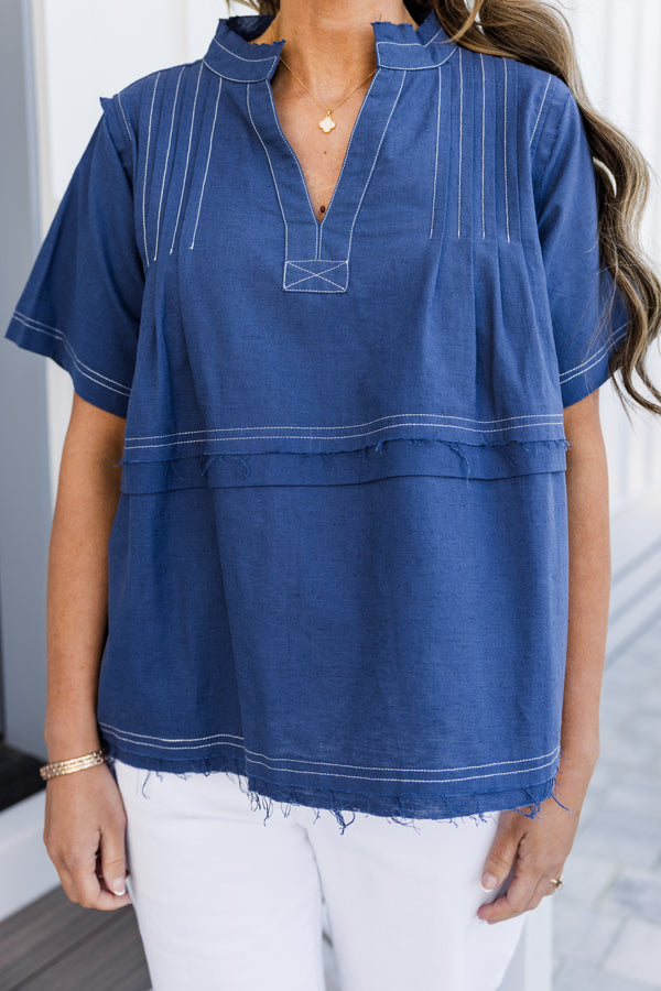 Chic soul plus size clothing, navy baby doll top with white stitching throughout the top, and a slight v-neck 