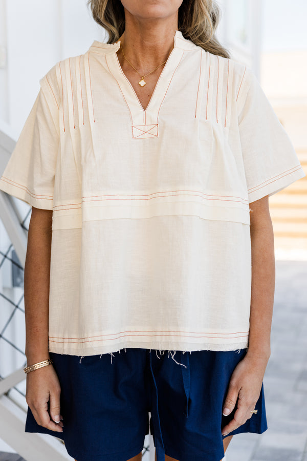 Chic Soul plus size clothing, short-sleeve white top with a pintuck stitching and an unfinished distressed hem 