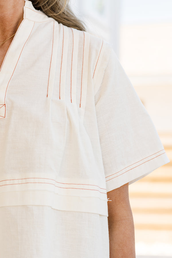 Chic Soul plus size clothing, short-sleeve white top with a pintuck stitching and an unfinished distressed hem 