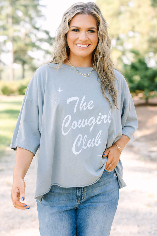 Plus size woman in a steel blue Cowgirl Clubbing vintage wash tee with a relaxed, flowy fit.