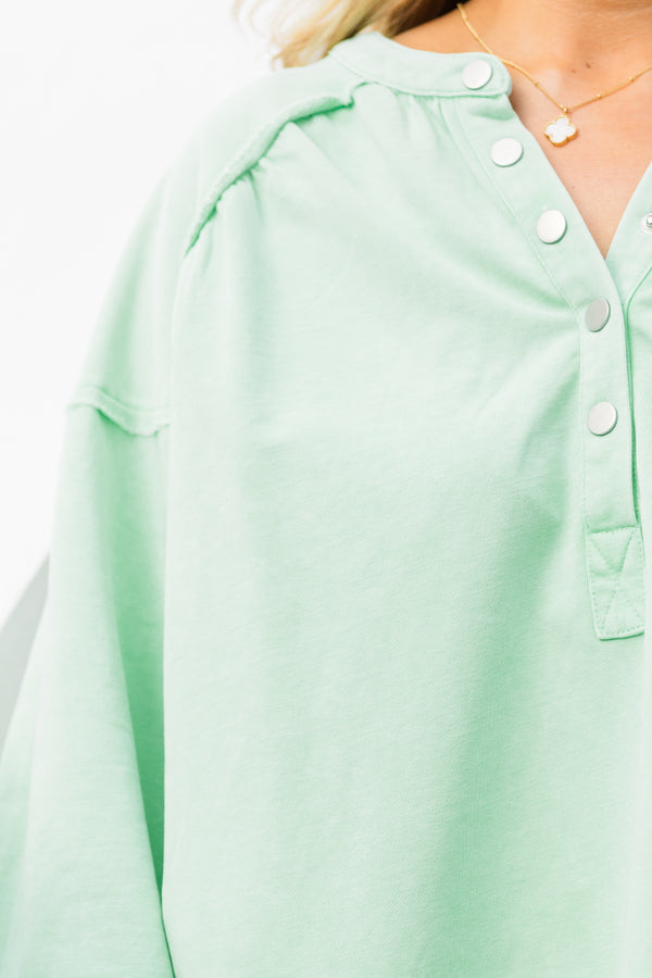 Chic Soul plus size clothing, mint long sleeve pullover with button up detail on neckline with cuffed puff sleeves with raw hem along bottom
