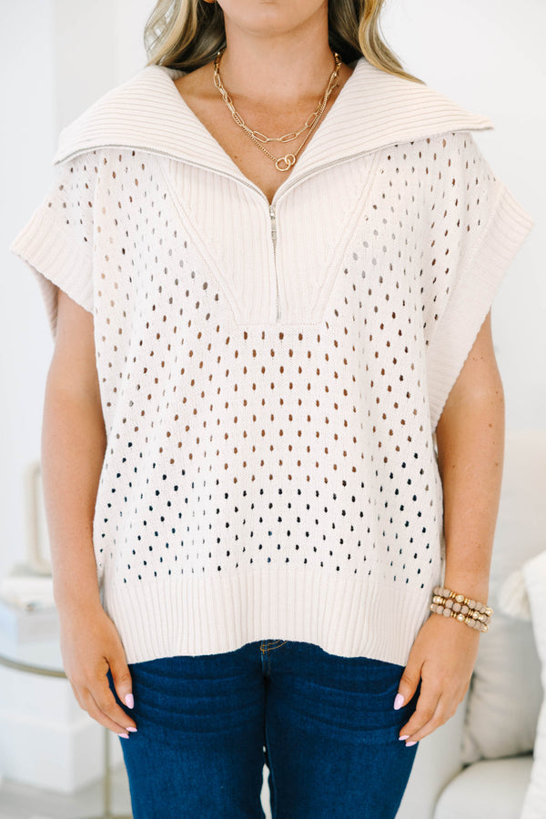 Plus Size taupe knit sweater with a quarter-zip collar, short sleeves, and open-stitch pattern.