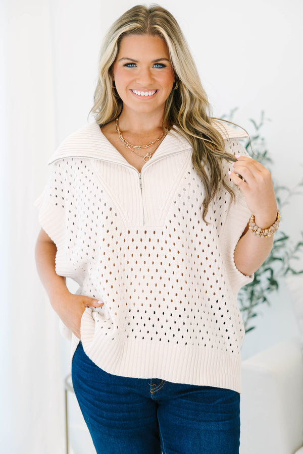 Plus Size taupe knit sweater with a quarter-zip collar, short sleeves, and open-stitch pattern.