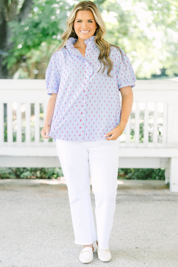 Plus Size blue gingham button-down top with red embroidery, ruffled collar, and puff sleeves.
