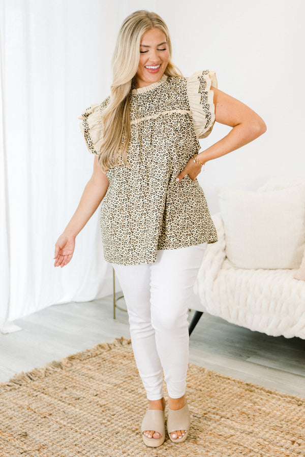 Chic Soul plus size clothing, leopard top with a high neckline and flutter sleeves that have a white ruffle detail on the tops of each sleeve 