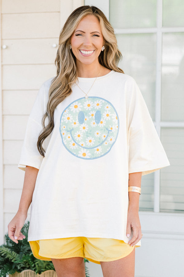 Chic Soul plus size clothing, short-sleeve ivory boyfriend tee with a high-scoop-neckline with a blue outline of a smiley face filled with a blue background and white daisy pattern