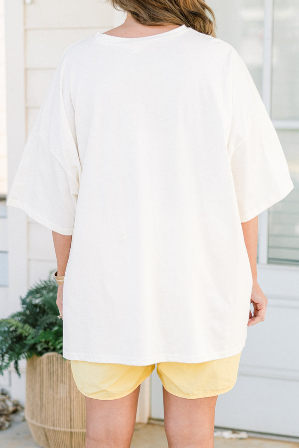 Chic Soul plus size clothing, short-sleeve ivory boyfriend tee with a high-scoop-neckline with a blue outline of a smiley face filled with a blue background and white daisy pattern